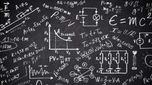 Blackboard with lots of physics calculations and equasions