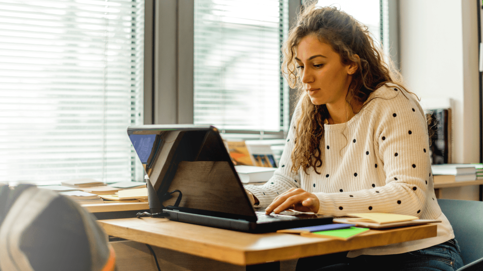 Female learner studying at a laptop